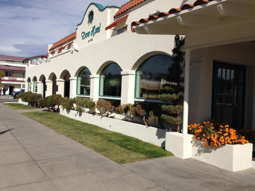 a building with flowers outside of a store at Historic Dow Hotel in Lone Pine