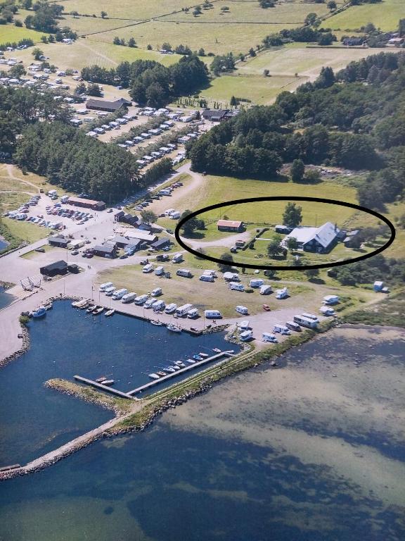 an aerial view of a marina with a bunch of cars at Susanne's stugor Böda hamn in Böda