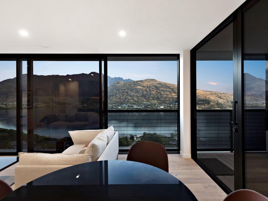 a living room with a view of the mountains at The Bunker Bravo B in Queenstown