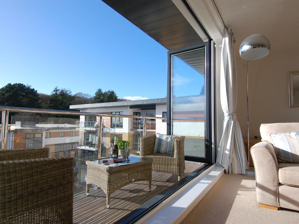 a balcony with a view of the ocean at 28 Clock Tower Court in Charlestown