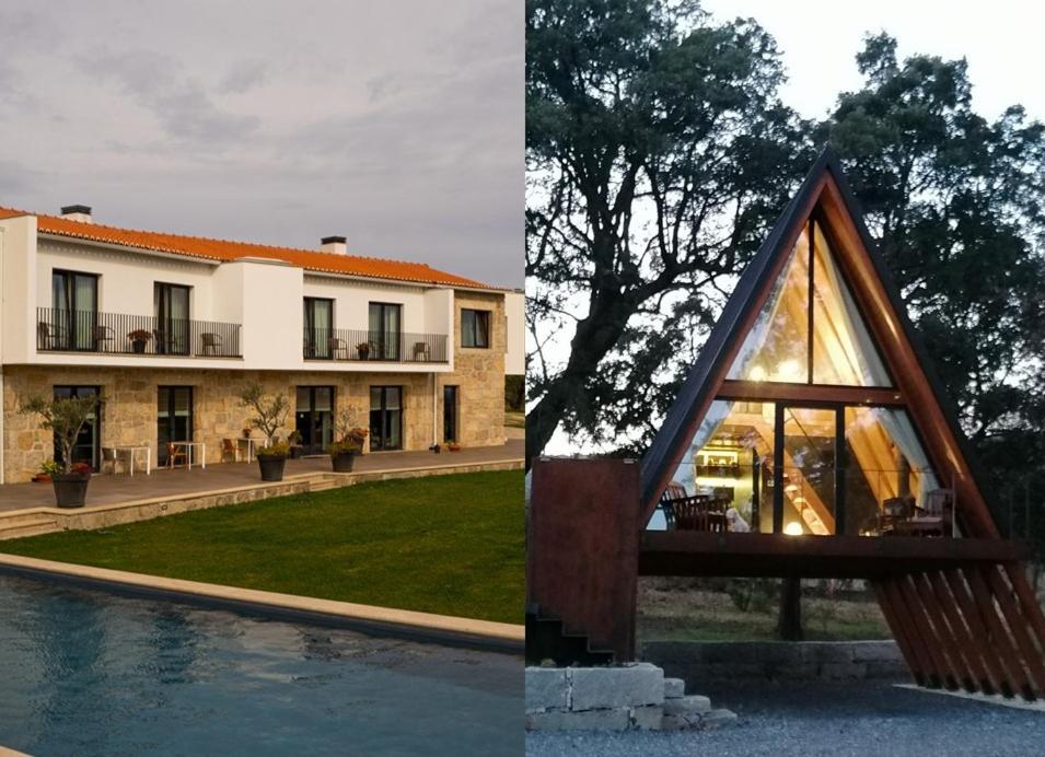 una casa con una finestra triangolare accanto a una piscina di Carvalhal Redondo - Farm House a Castelo Novo