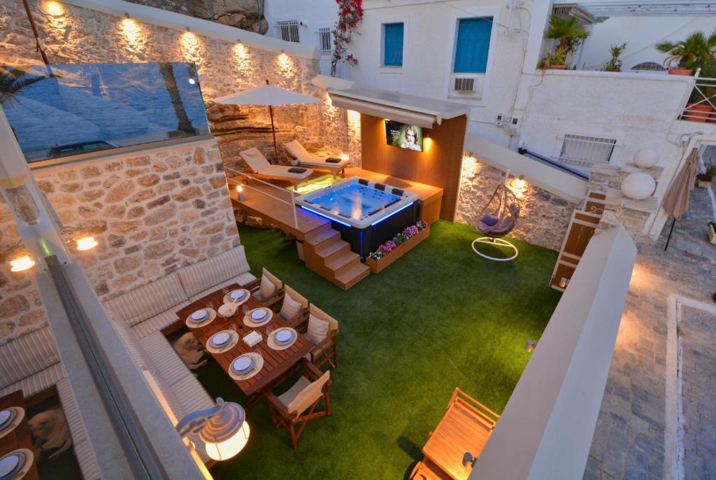 an image of a backyard with a hot tub at Villasonboard Ermioni Rock Villa jacuzzi seaside & boat dock in Ermioni