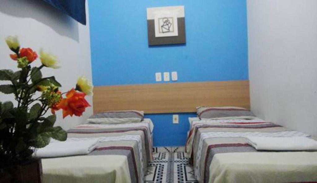 Postel nebo postele na pokoji v ubytování Hotel Pousada Executiva Itabuna