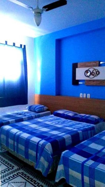 Postel nebo postele na pokoji v ubytování Hotel Pousada Executiva Itabuna