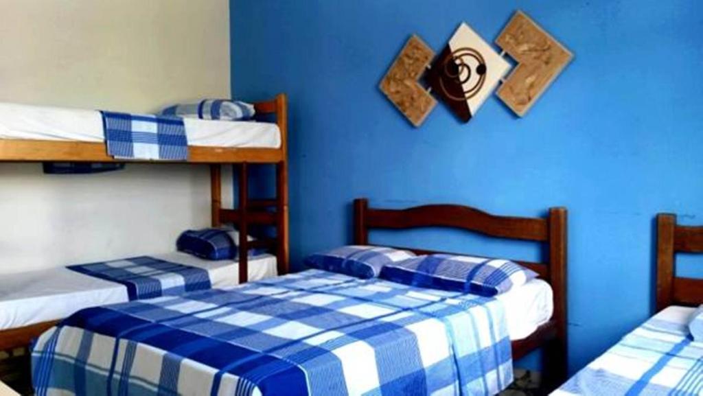 Postel nebo postele na pokoji v ubytování Hotel Pousada Executiva Itabuna