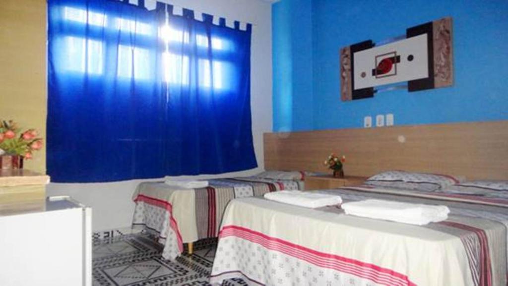 Postel nebo postele na pokoji v ubytování Hotel Pousada Executiva Itabuna