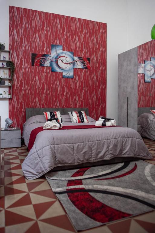 Postel nebo postele na pokoji v ubytování Pitagora House