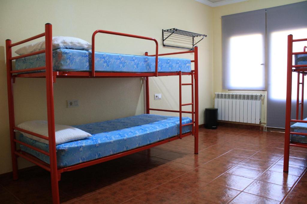 Postel nebo postele na pokoji v ubytování Albergue Los Chorros