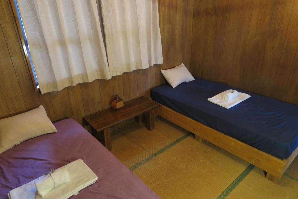 Postel nebo postele na pokoji v ubytování Hotel Hibiscus