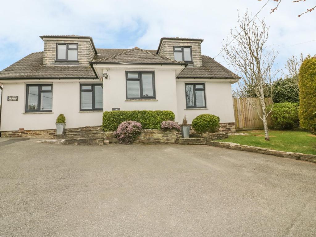 a house with a driveway in front of it at The Orchard in Crantock