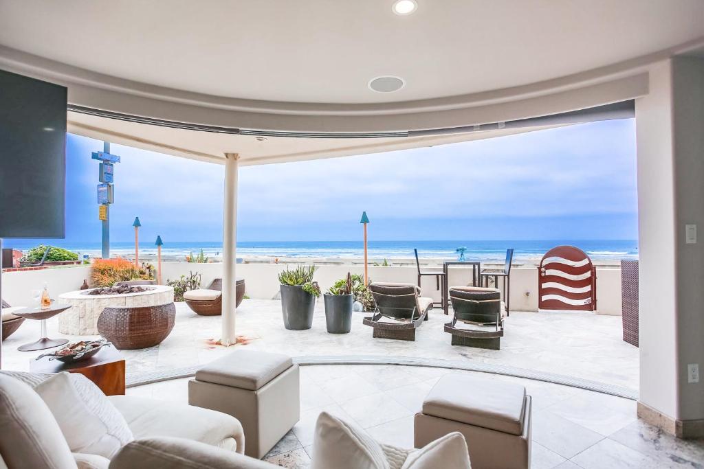 a living room with a view of the beach at Ostend Escape in San Diego