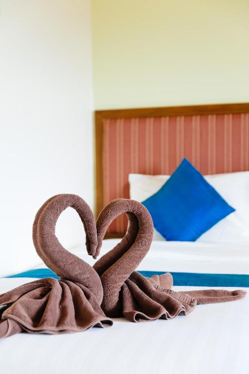 Postel nebo postele na pokoji v ubytování Thipurai Beach Hotel