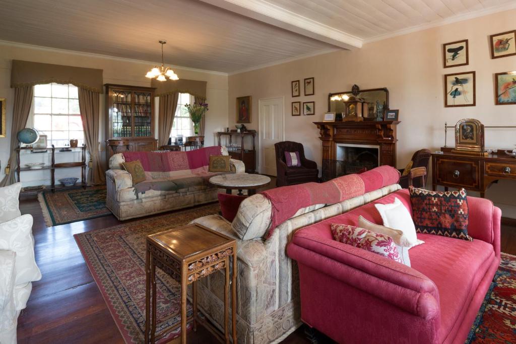 a living room filled with furniture and a fire place at Faversham House in York