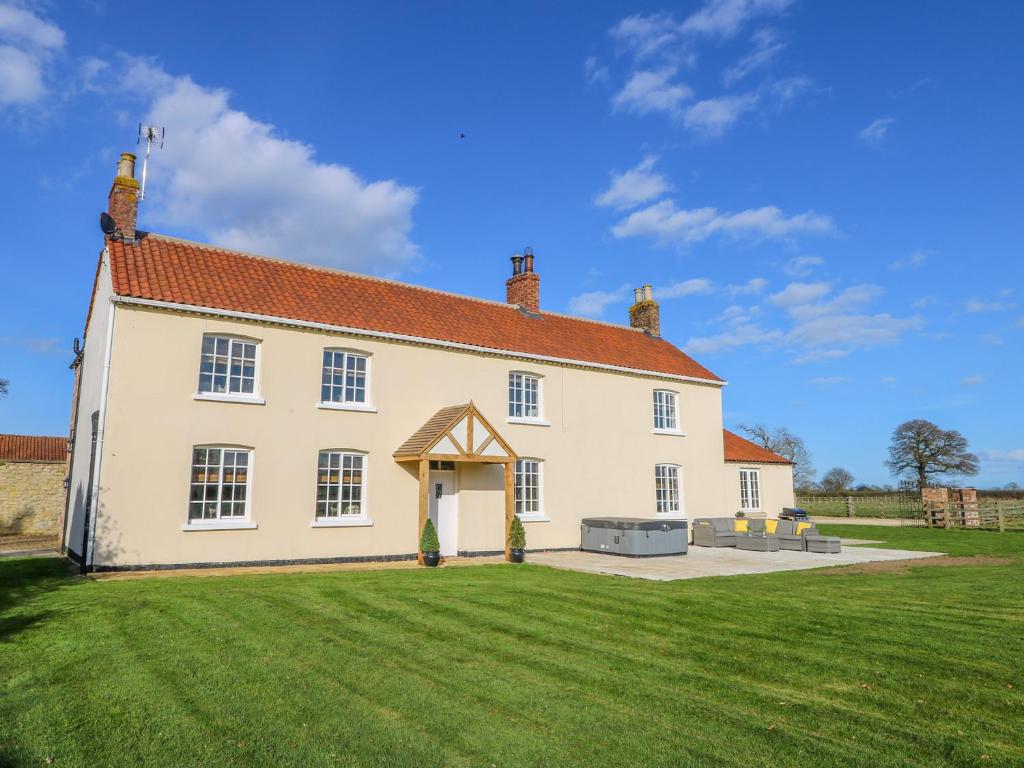 a large white house with a large yard at Tuft House in York