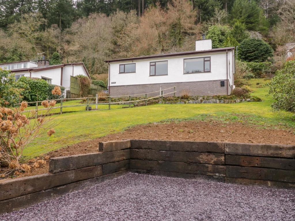 a house on a hill with a yard at The Dene in Betws-y-coed