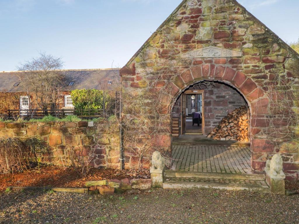 an entrance to a brick building with an archway at The Orangery in Turriff