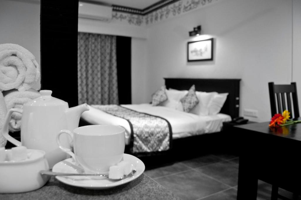 Postel nebo postele na pokoji v ubytování Liwa - The Transit Hotel, Bengaluru