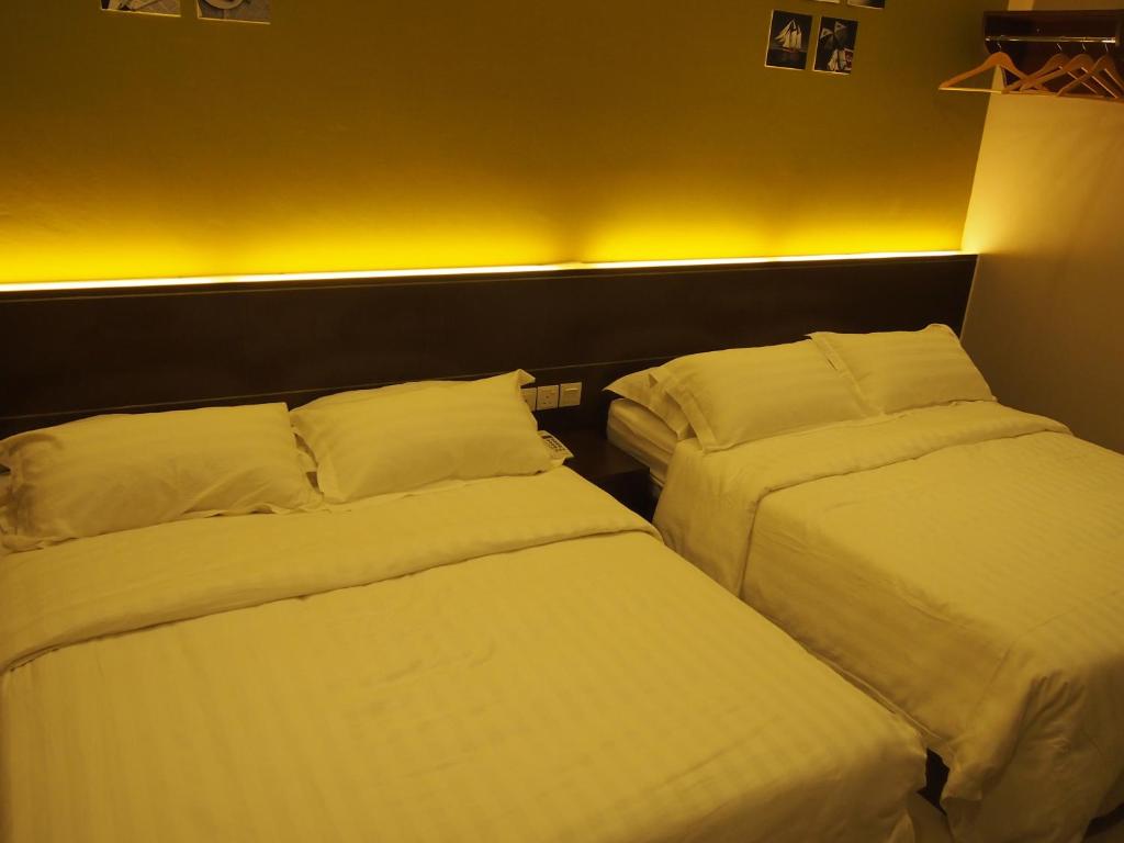 Postel nebo postele na pokoji v ubytování Star Bay Hotel