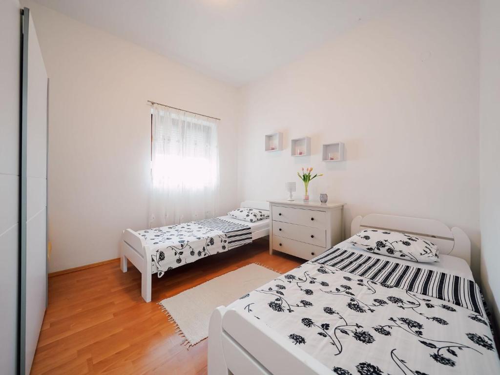 Posteľ alebo postele v izbe v ubytovaní Spacious apartment with swimming pool