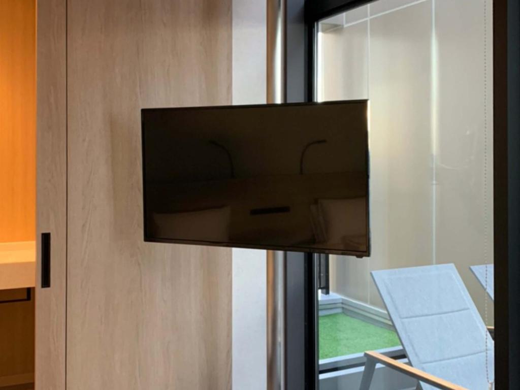TV a/nebo společenská místnost v ubytování Akabane Holic Hotel