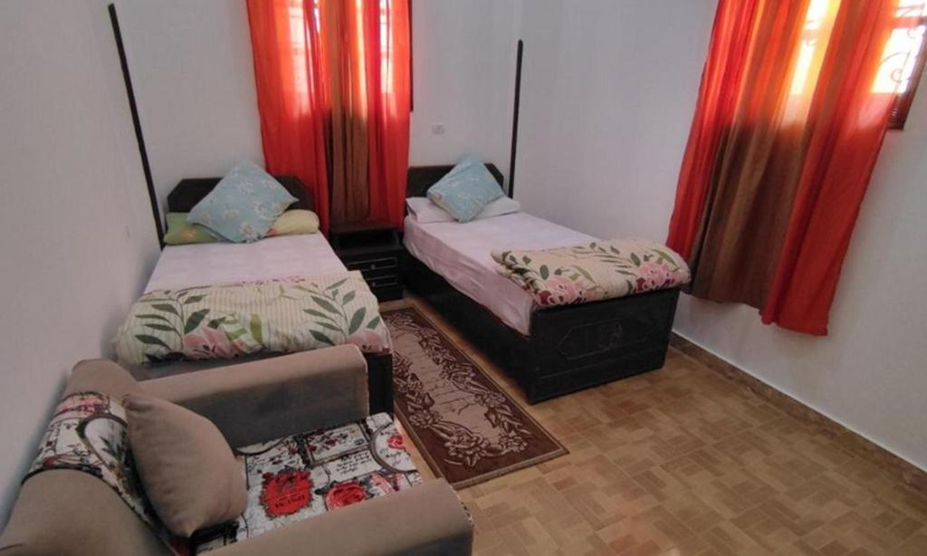 Postel nebo postele na pokoji v ubytování Isis Flats