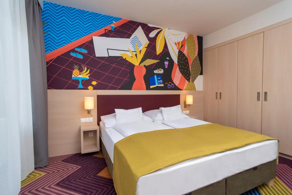 Postel nebo postele na pokoji v ubytování Kolping Family Resort