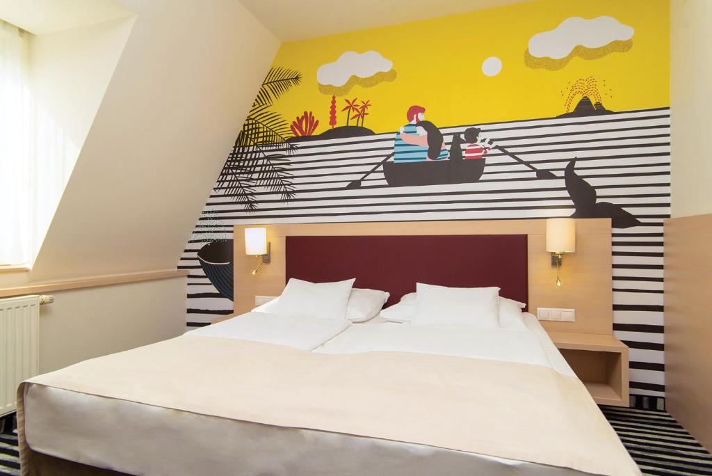 Postel nebo postele na pokoji v ubytování Kolping Family Resort