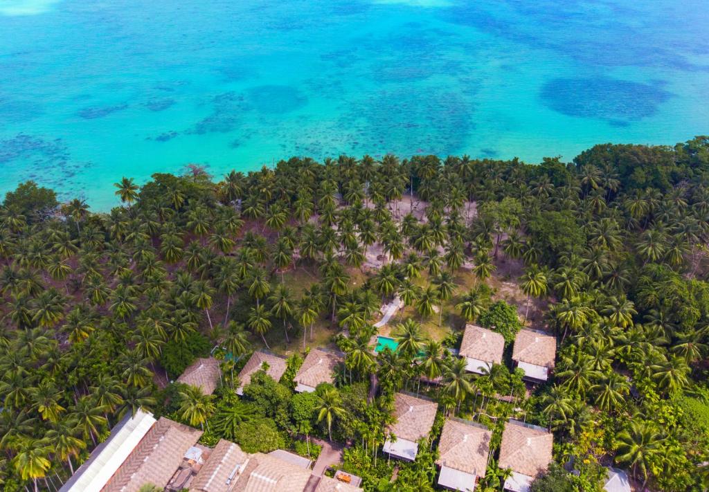 an aerial view of a resort on a tropical island at Tilar Siro Andamans - CGH Earth in Havelock Island