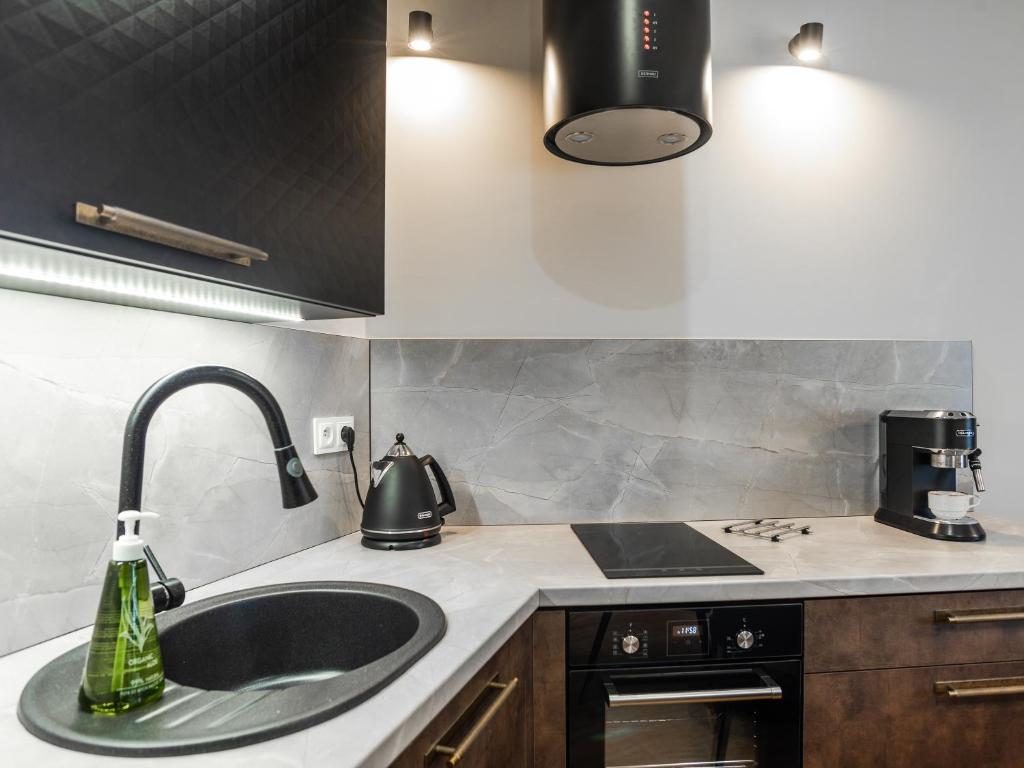 Kuchyňa alebo kuchynka v ubytovaní Apartamenty na Polnej