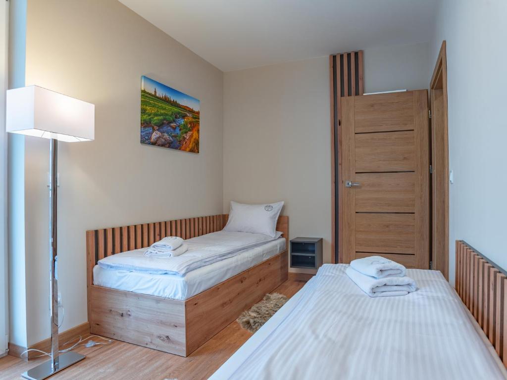 Posteľ alebo postele v izbe v ubytovaní Apartamenty na Polnej