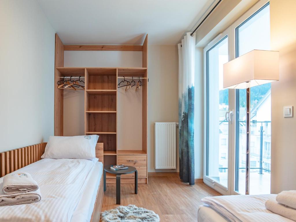 Posteľ alebo postele v izbe v ubytovaní Apartamenty na Polnej