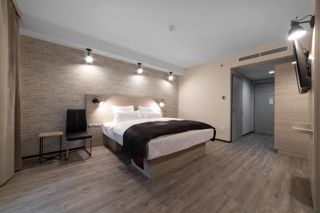 Posteľ alebo postele v izbe v ubytovaní DORMERO Hotel Budapest