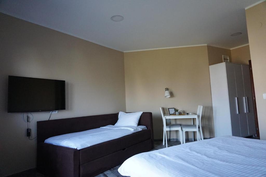 Postel nebo postele na pokoji v ubytování Guesthouse & restaurant Tekovina