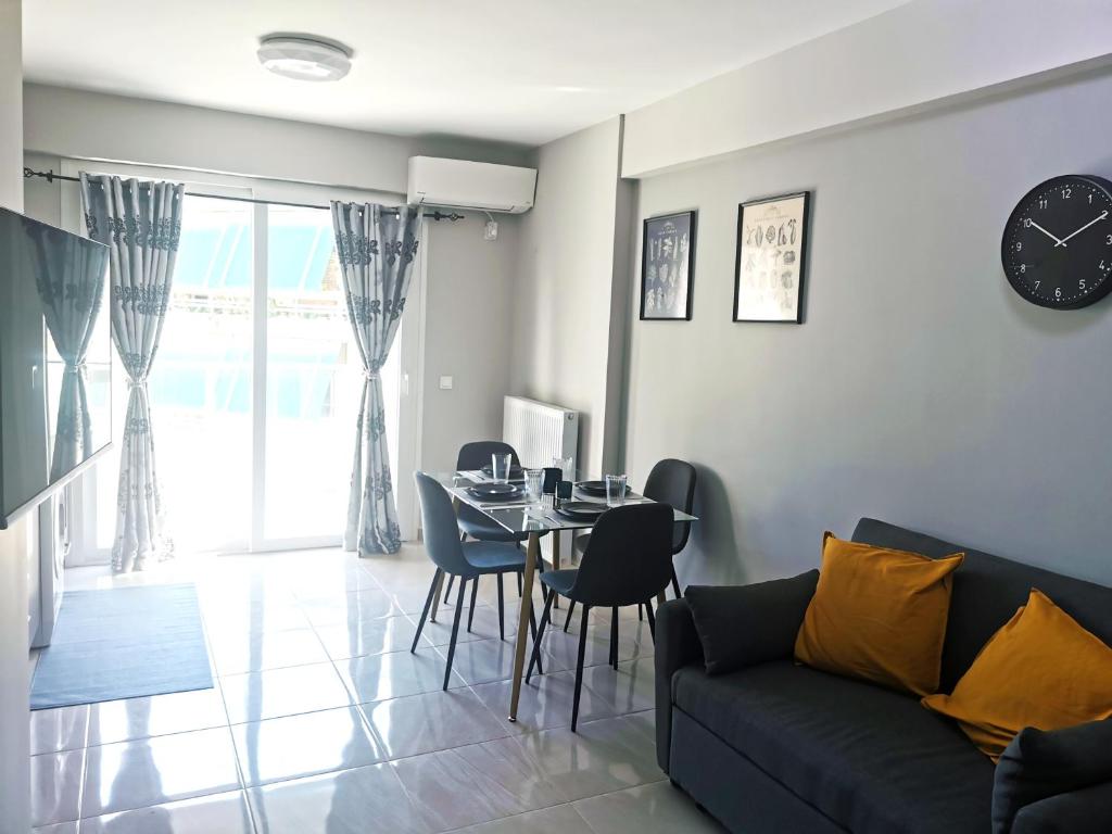 a living room with a table and a couch at 7-Athens new morden comfortable-center,metro,private parking in Athens