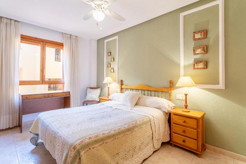 A bed or beds in a room at El Albero