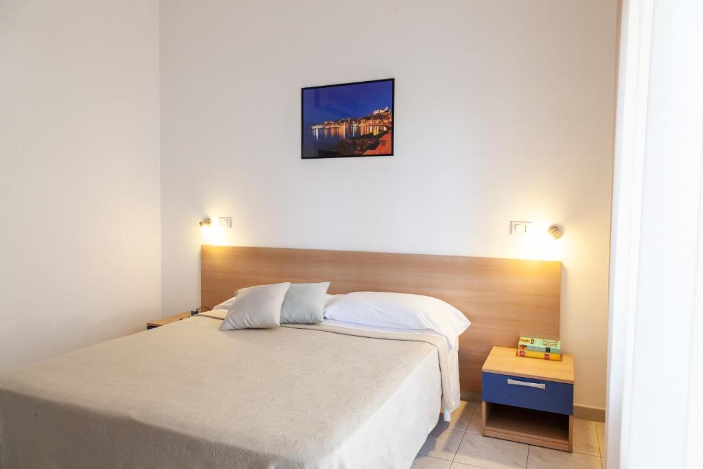 Postel nebo postele na pokoji v ubytování Hotel Viola