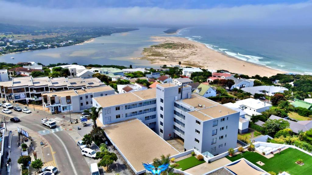 an aerial view of a city with a beach and buildings at Summerhill Self-Catering Holiday Accommodation in Plettenberg Bay