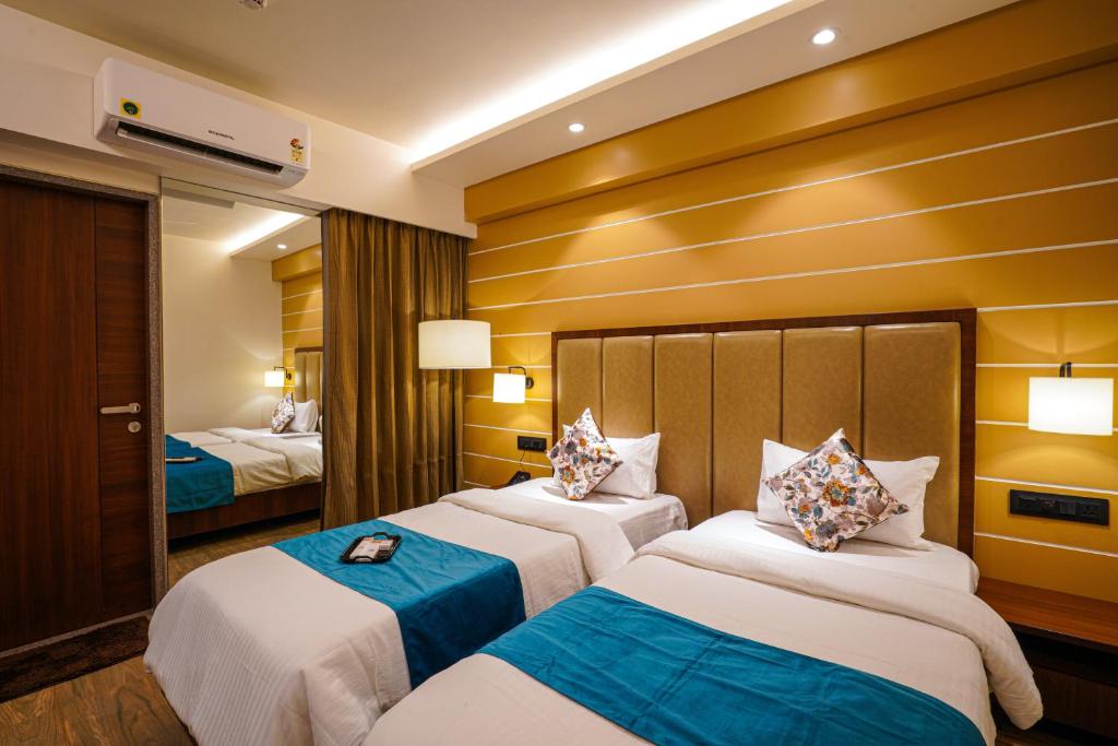 Postel nebo postele na pokoji v ubytování Hotel El Magnifico