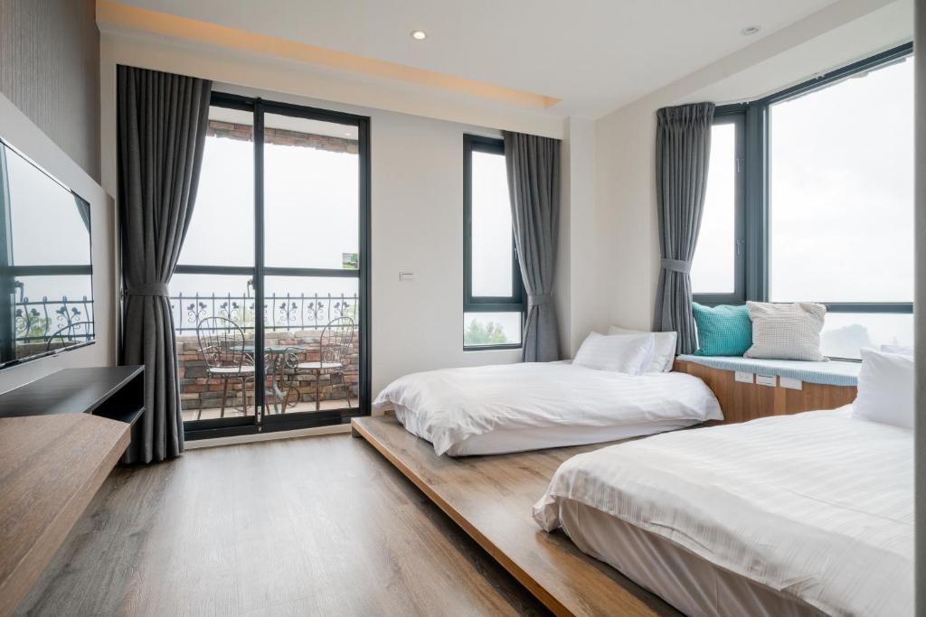 Voodi või voodid majutusasutuse Cingjing Florence Resort Villa toas
