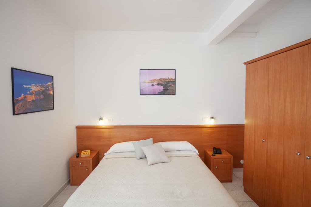 Postel nebo postele na pokoji v ubytování Hotel Viola