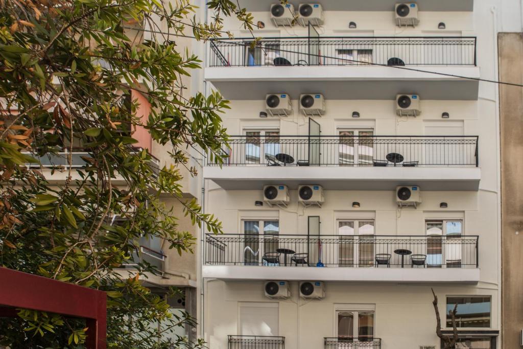 an apartment building with air conditioners on it at Olympus Residence in Athens