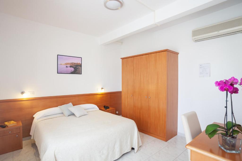 Postel nebo postele na pokoji v ubytování Hotel Viola