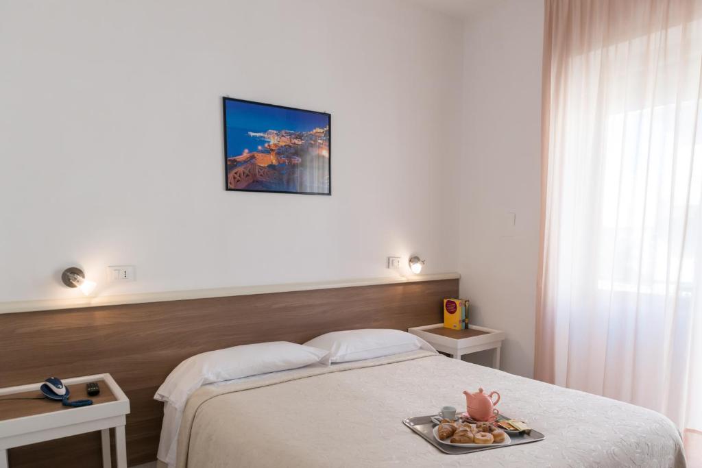 Postel nebo postele na pokoji v ubytování Hotel Viola