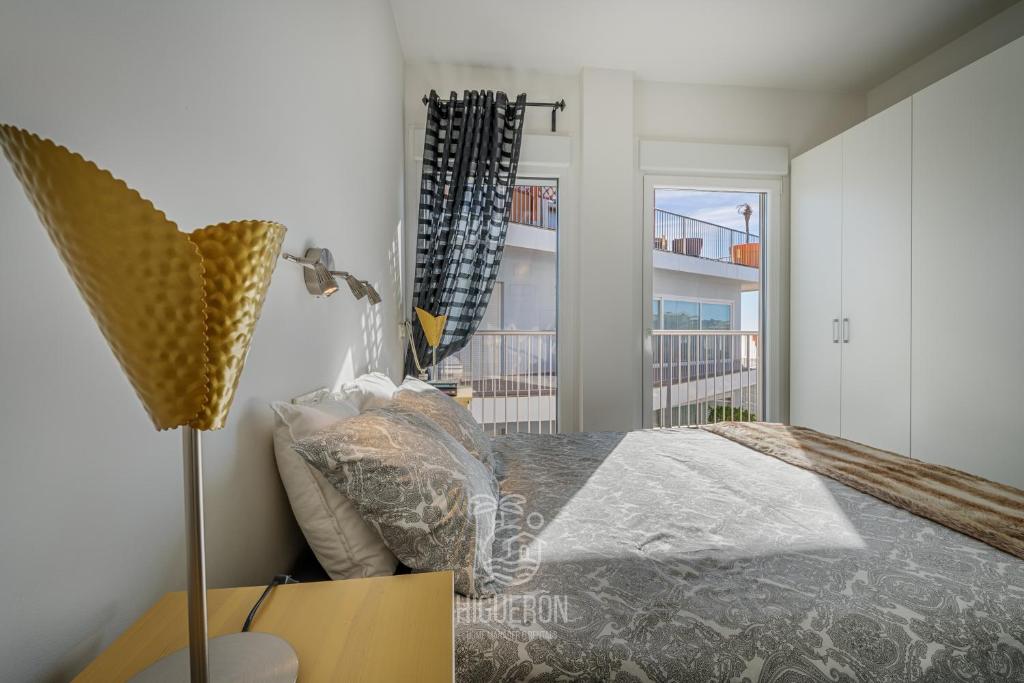 Posteľ alebo postele v izbe v ubytovaní HigueronRentals Gucci