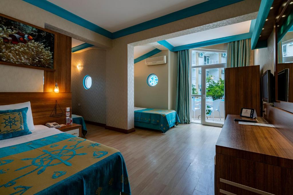 Postel nebo postele na pokoji v ubytování Miarosa Kemer Beach