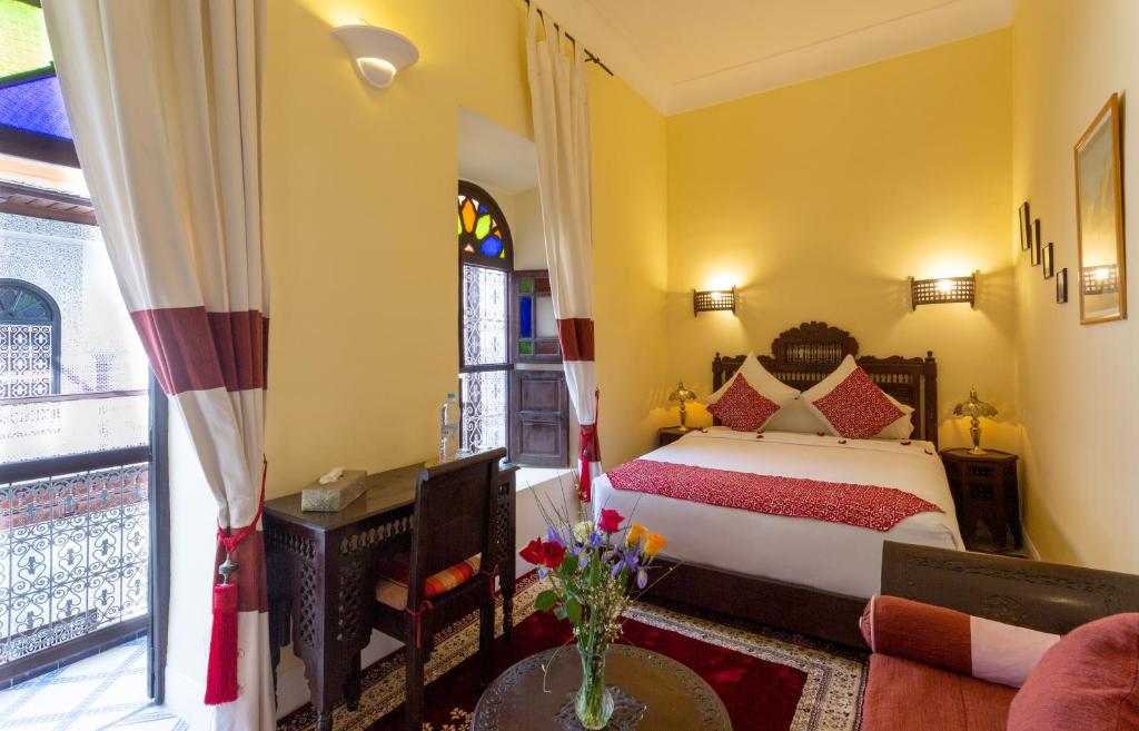 Postel nebo postele na pokoji v ubytování Riad Al Jana
