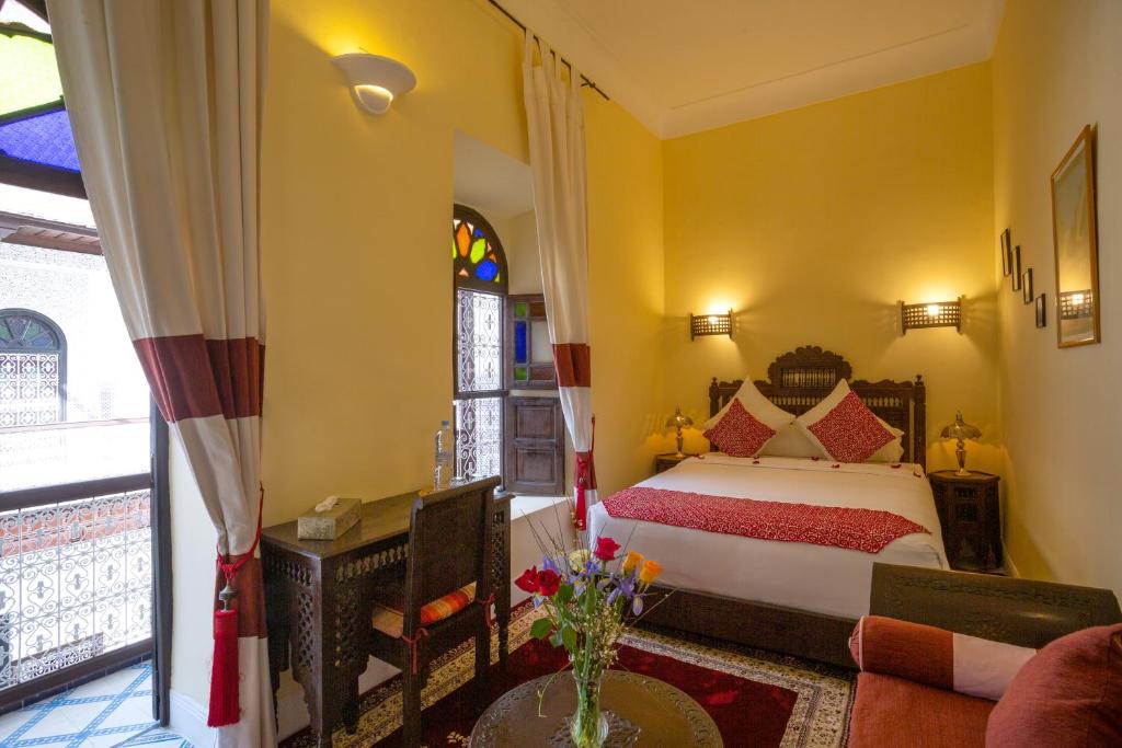 Postel nebo postele na pokoji v ubytování Riad Al Jana