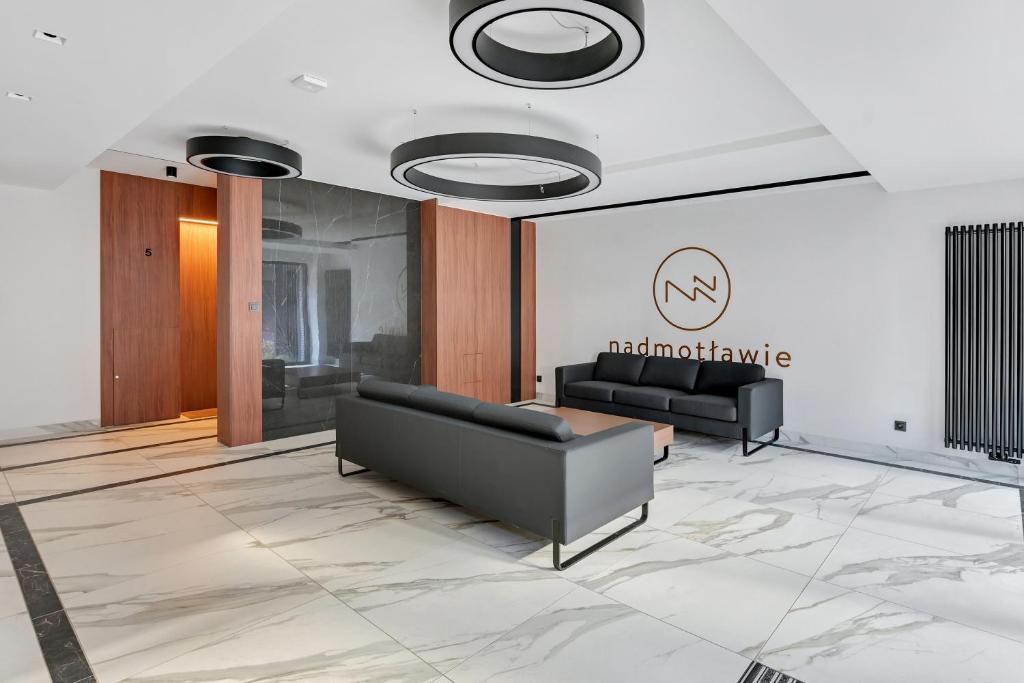 Posezení v ubytování Nadmotławie Sauna & Gym by Blue Mandarin