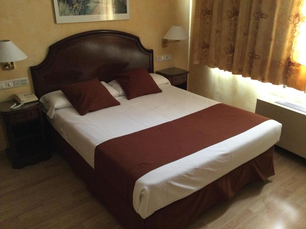 Postel nebo postele na pokoji v ubytování Hotel Cordón