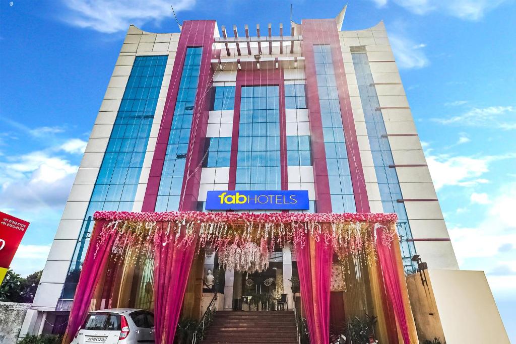 a building with a sign on the front of it at FabHotel Prime Z Grand in Ludhiana